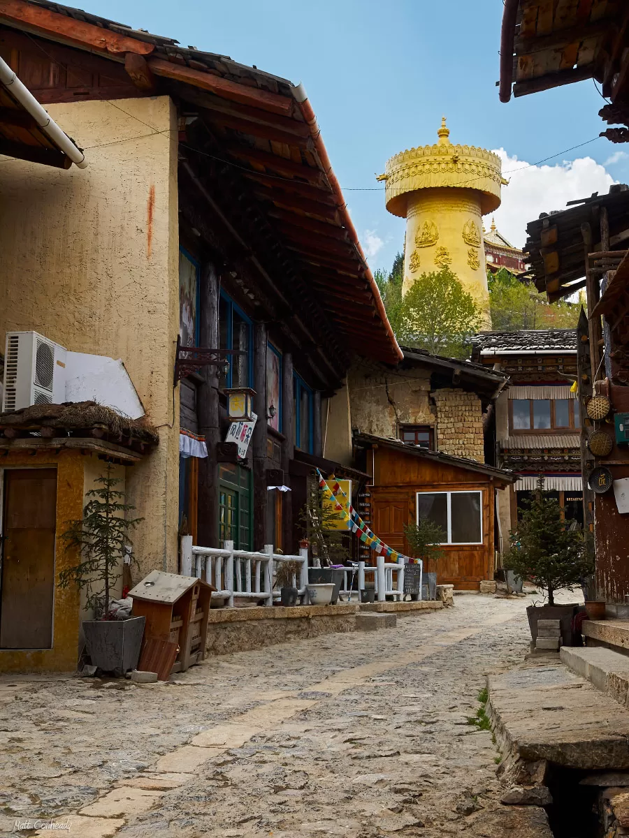 Shangri-la street scene with golden prayer wheel