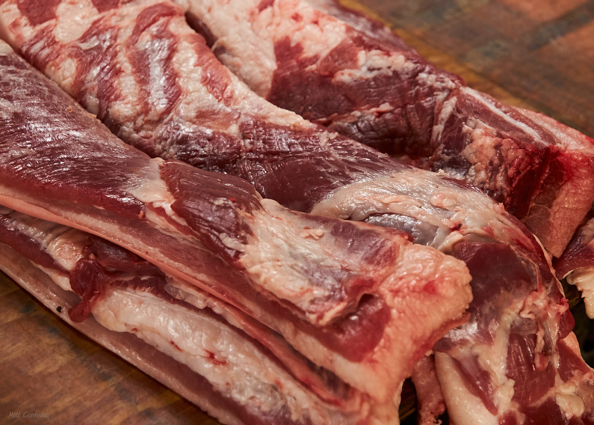 cuts of fresh pork back on a table