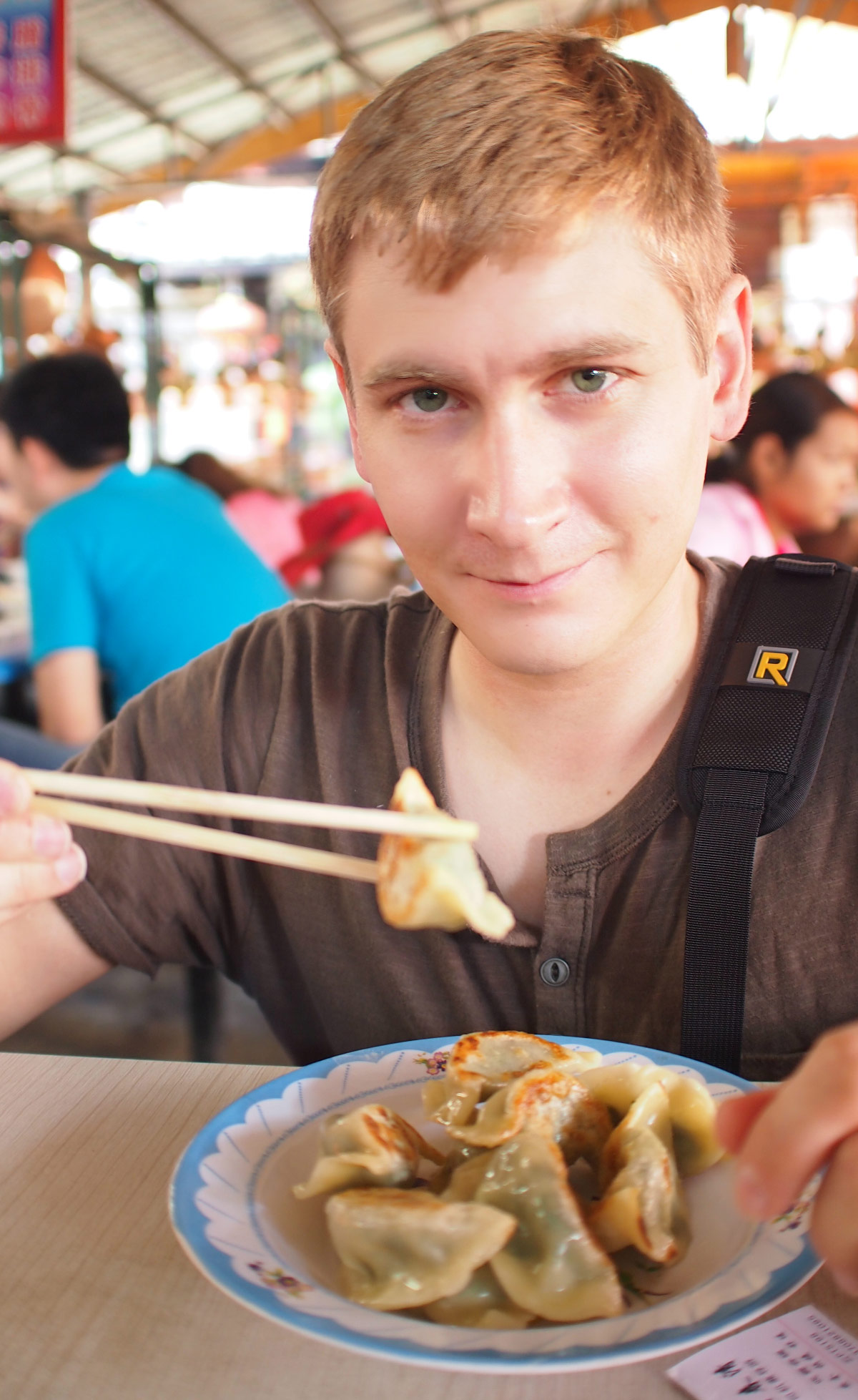 Matthew Conheady eating dumplings in Lijiang, China