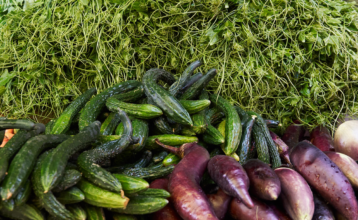 stacks of fresh vegetables at the lijiang open air market