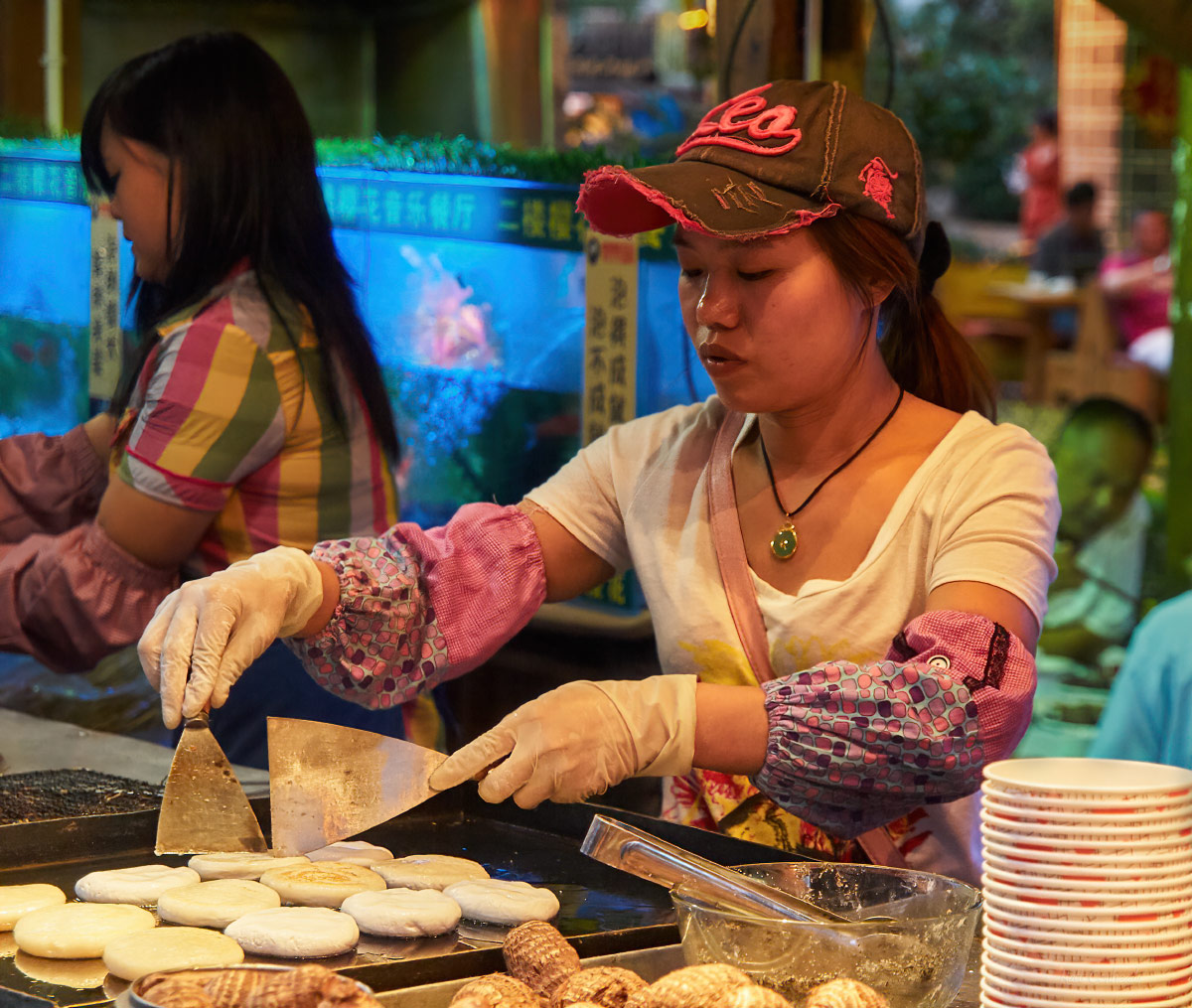 street food vendor in lijiang flipping pancakes