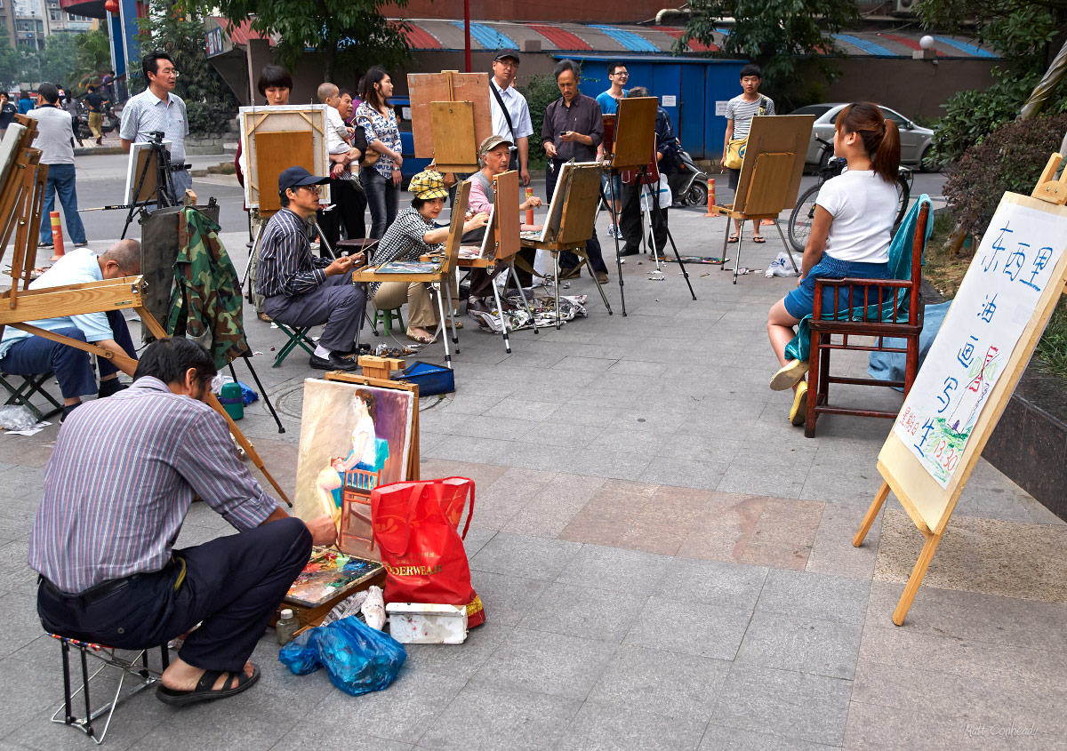 A young woman is poses for portraits on the streets of Chengdu