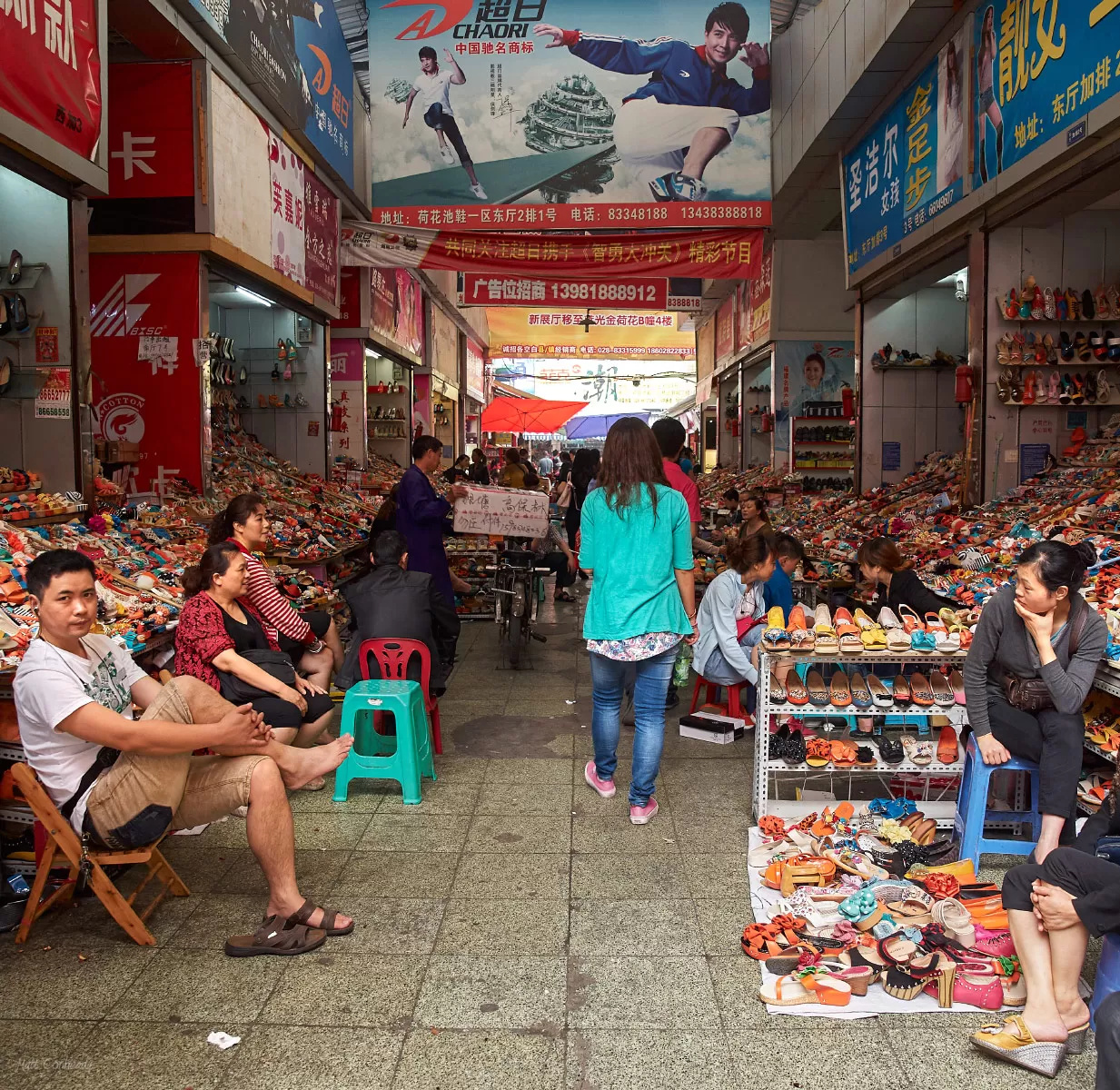 shoe vendors in a building at the lotus market in chengdu