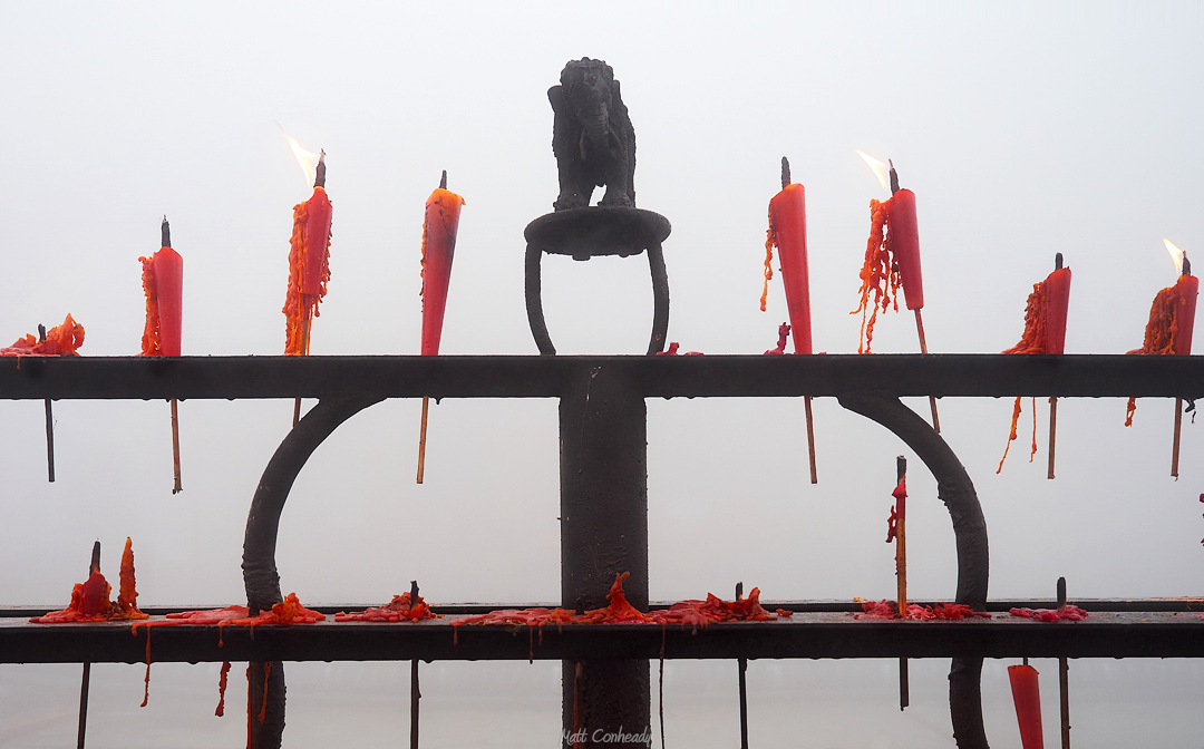 burning candles in fog on Mt Emei 