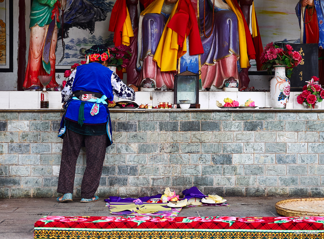 making an offering in a temple in Dali