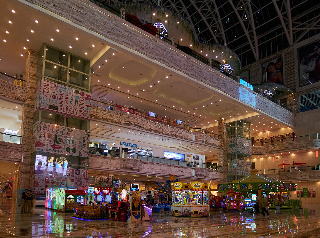 Interior view of the Chengdu Global Center, with shops and kid's park/arcade