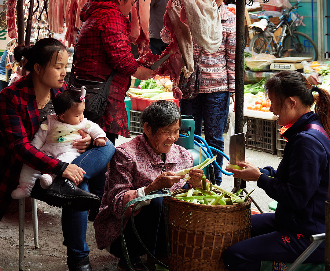 A family at the Zhangjiajie Open Air Market