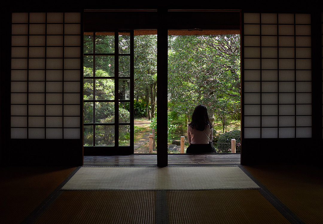 sitting at the doorway of an edo-era Japanese home